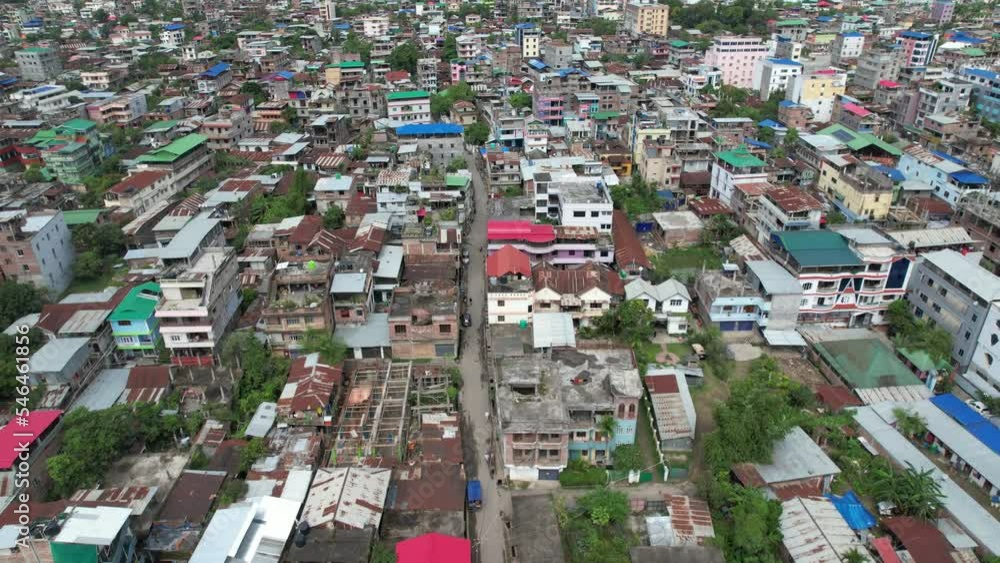 Aerial Shot Of Slums House With Mountains In Background, India Aerial Shot Of Slums House With Mountains In Background, India