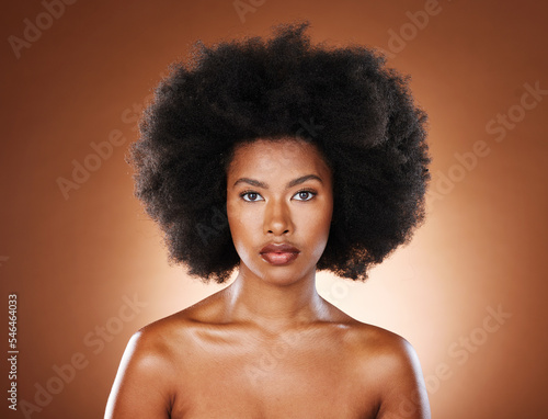 Black woman, face and afro for natural hair care wellness for beauty. African girl model, facial glow or skin healthcare, confident and proud portrait for healthy cosmetics dermatology in studio photo