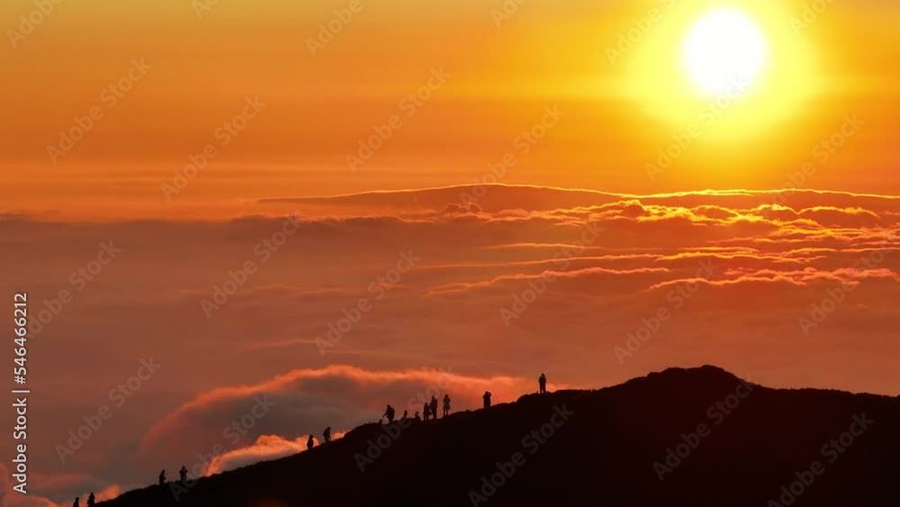 Aerial view Silhouette Of Tourists On Mountain Top During Dramatic Sunset Aerial view Silhouette Of Tourists On Mountain Top During Dramatic Sunset
