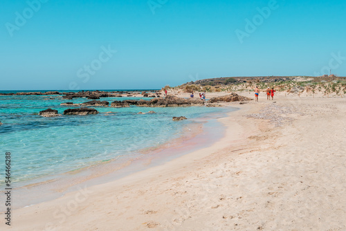 Elafonisi  crete island  greece  pink colored sandy beach with black rocks at the famous cretan lagoon