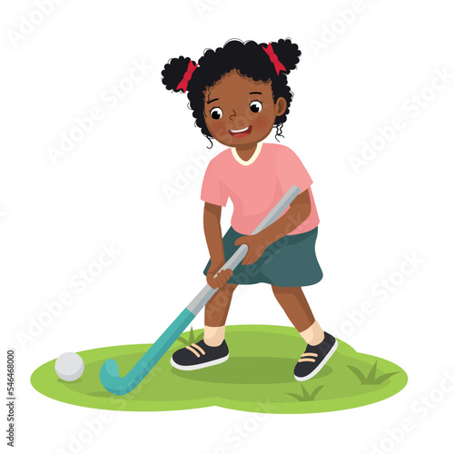 cute little African girl playing hockey photo