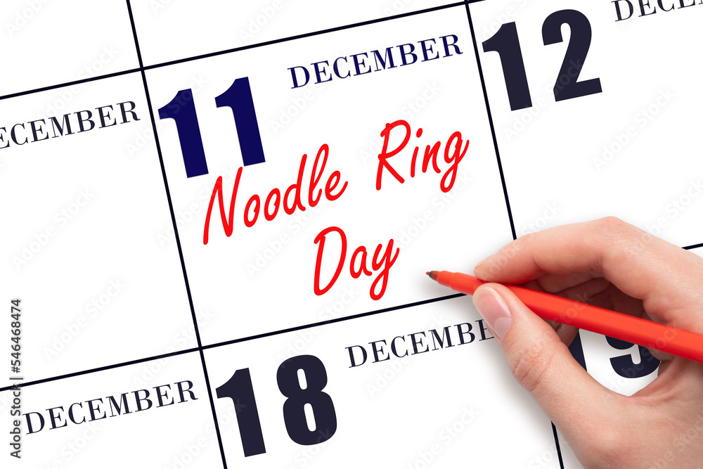 December 11. Hand writing text Noodle Ring Day on calendar date. Save the date. Day of the year concept. December 11. Hand writing text Noodle Ring Day on calendar date. Save the date. Day of the year concept.