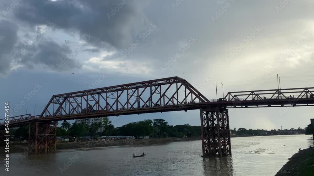 Keane (King) bridge silhouette over Surma river in Sylhet, handheld view Keane (King) bridge silhouette over Surma river in Sylhet, handheld view