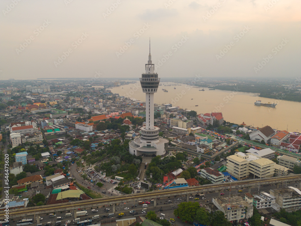 Naklejka premium Aerial top view of observation deck viewpoints tower, Samut Prakan urban city town skyline view. Sightseeing exploring city skyline in travel on holiday vacation. Thailand.
