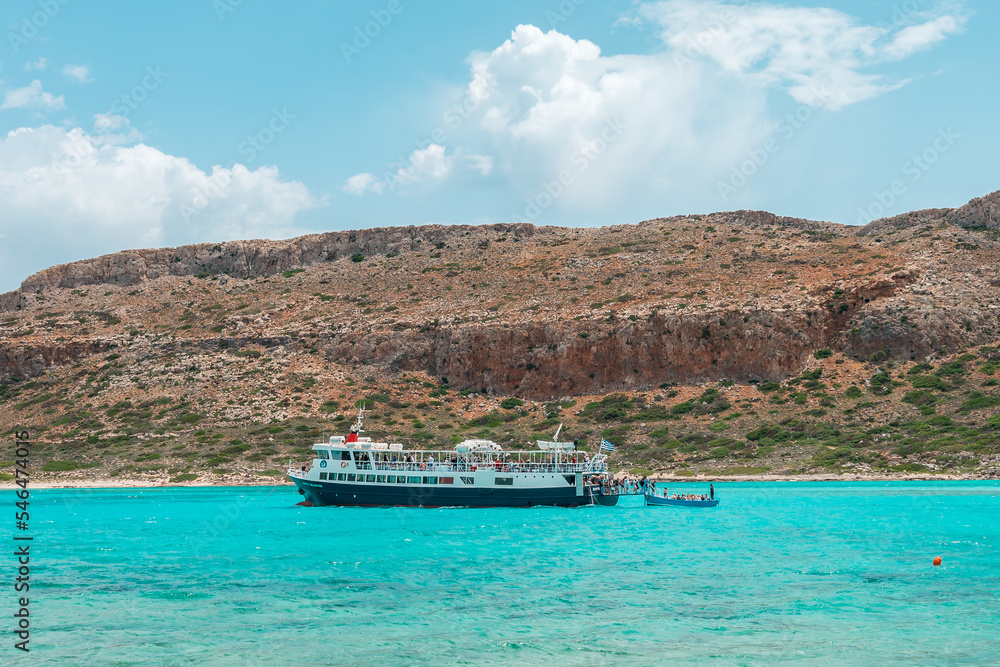 Balos lagoon, crete island, greece: boat cruise to the white sandy beach and turquoise blue water at the main tourist destination near chania