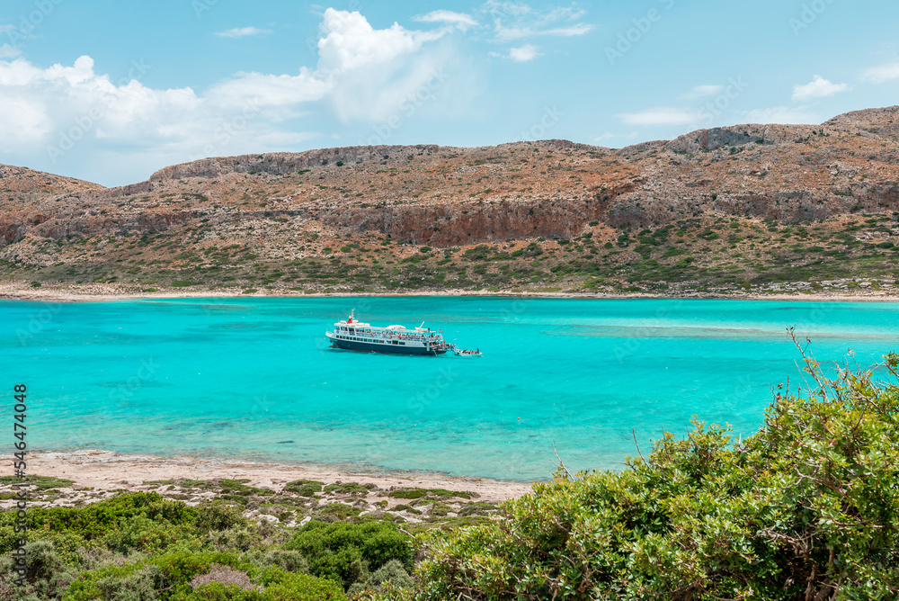 Balos lagoon, crete island, greece: boat cruise to the white sandy beach and turquoise blue water at the main tourist destination near chania
