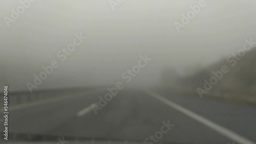 car driving through fog