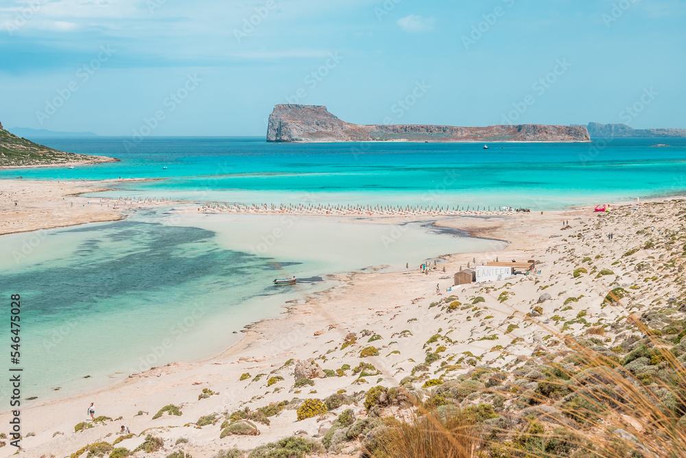 Balos lagoon, crete island, greece: view to gramvoussa island with white sandy beach and turquoise blue water at the main tourist destination near chania