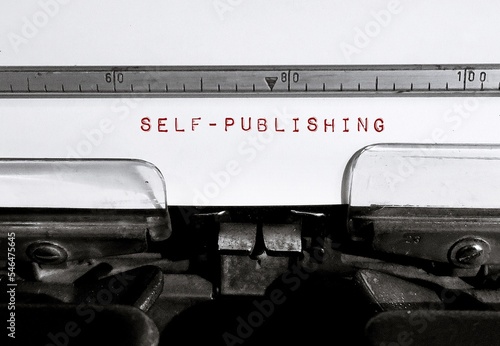 фотографія Classic retro typewriter with text SELF-PUBLISHING, act of writer publish piece