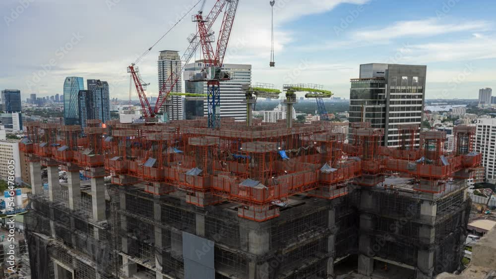 Time lapse aerial view of construction site with tower crane urban construction Rush hour of concrete pouring Time lapse aerial view of construction site with tower crane urban construction Rush hour of concrete pouring