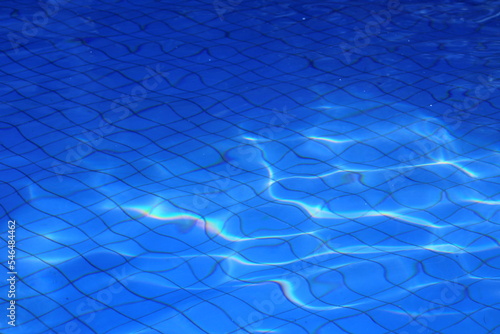 The clear blue swimming pool water (ID: 546484462)