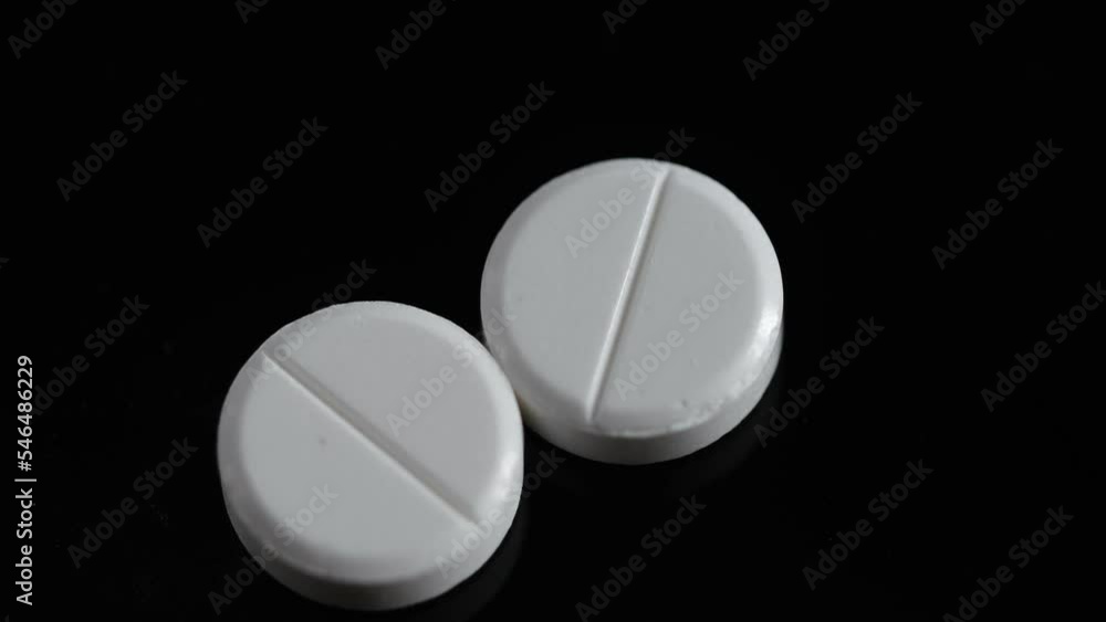 Macro shot of medical pills. Pills and drugs Pharmaceutical Industry. Rotation 4K Macro shot of medical pills. Pills and drugs Pharmaceutical Industry. Rotation 4K