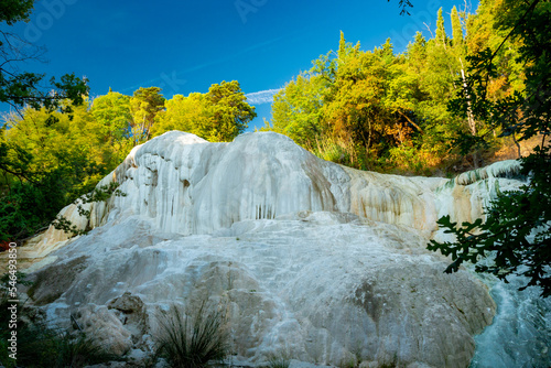 Bagni San Filippo natural thermal waterfall in Tuscany, Italy photo