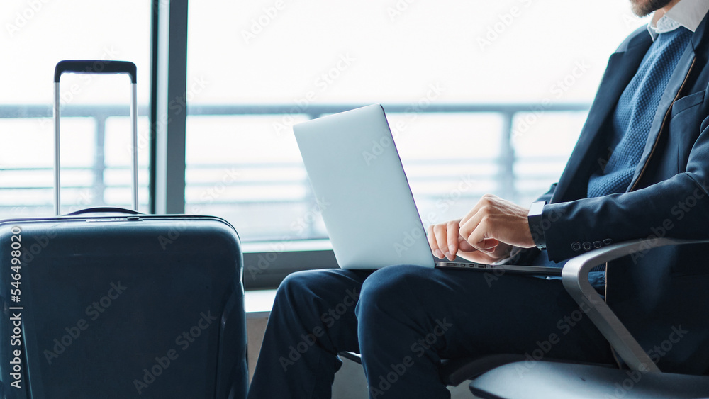 business man using his laptop during a business trip.