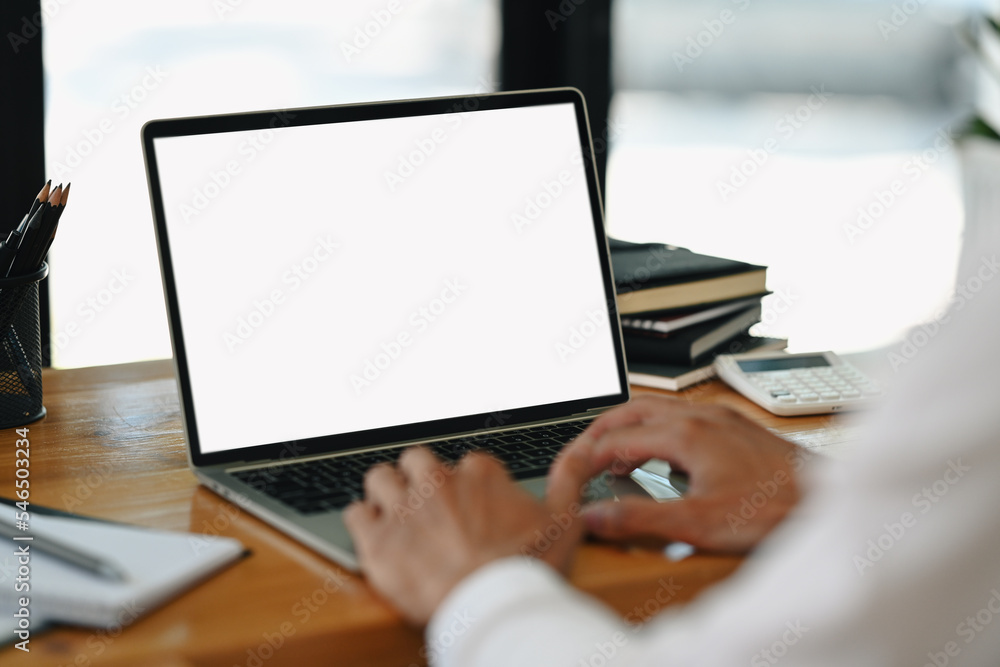 Close up view of businessman hands typing on laptop, working online from home. Blank screen for your advertise text Close up view of businessman hands typing on laptop, working online from home. Blank screen for your advertise text