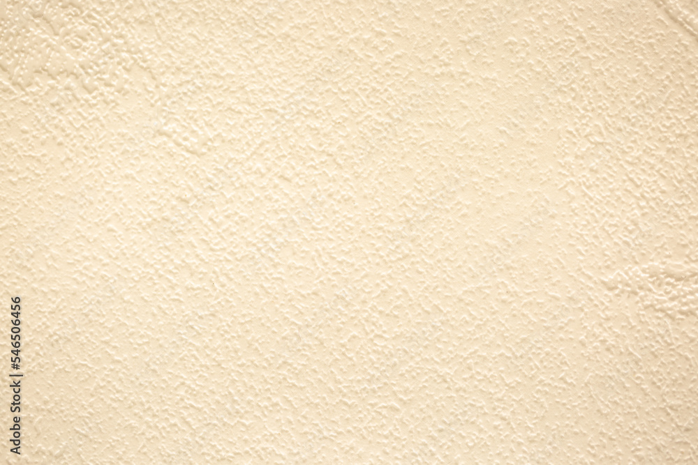 Brown background from decorative plaster with abstract spots. Unusual beige wall texture with beautiful patterns, creative surface background. Front covering for facing of buildings. Brown background from decorative plaster with abstract spots. Unusual beige wall texture with beautiful patterns, creative surface background. Front covering for facing of buildings.