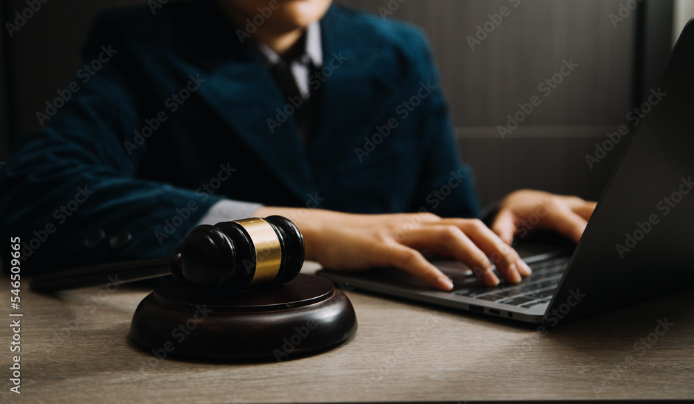 Business and lawyers discussing contract papers with brass scale on desk in office. Law, legal services, advice, justice and law concept Business and lawyers discussing contract papers with brass scale on desk in office. Law, legal services, advice, justice and law concept