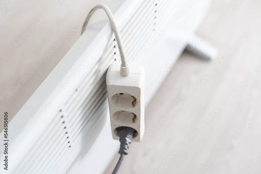 electric heater and extension cord. electric heater and extension cord.