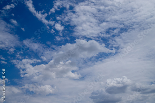 Beautiful blue sky with white Altocumulus undulatus clouds.