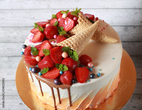 Closeup dessert with strawberries and mint waffles cream cake