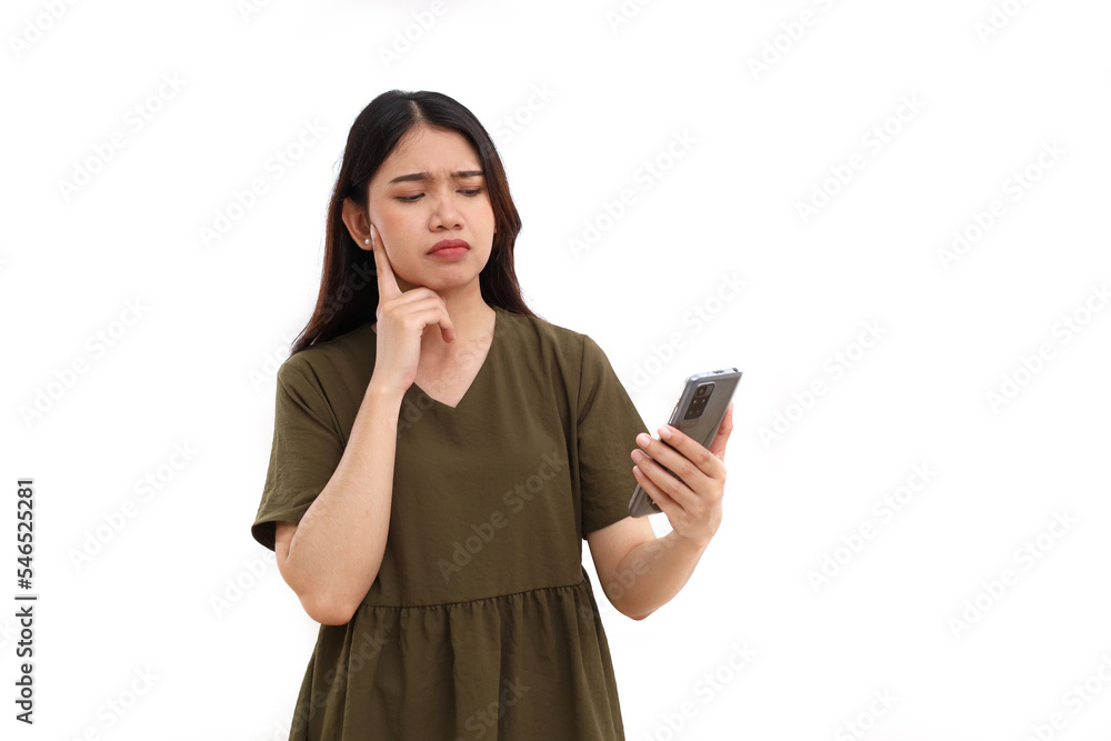 Young asian woman holding cell phone while thinking something. Isolated on white with copyspace Young asian woman holding cell phone while thinking something. Isolated on white with copyspace