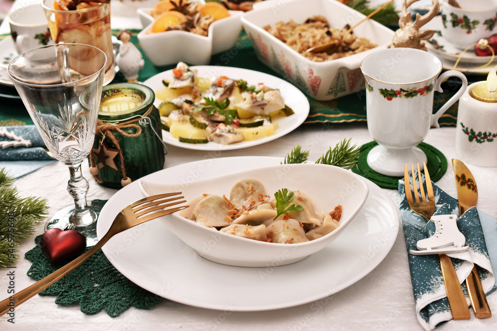 Christmas Eve table with dumplings and other traditional dishes