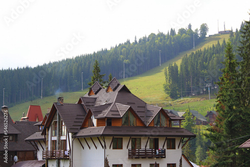 Multi pitched roof of a large private house in a suburban village in the mountains