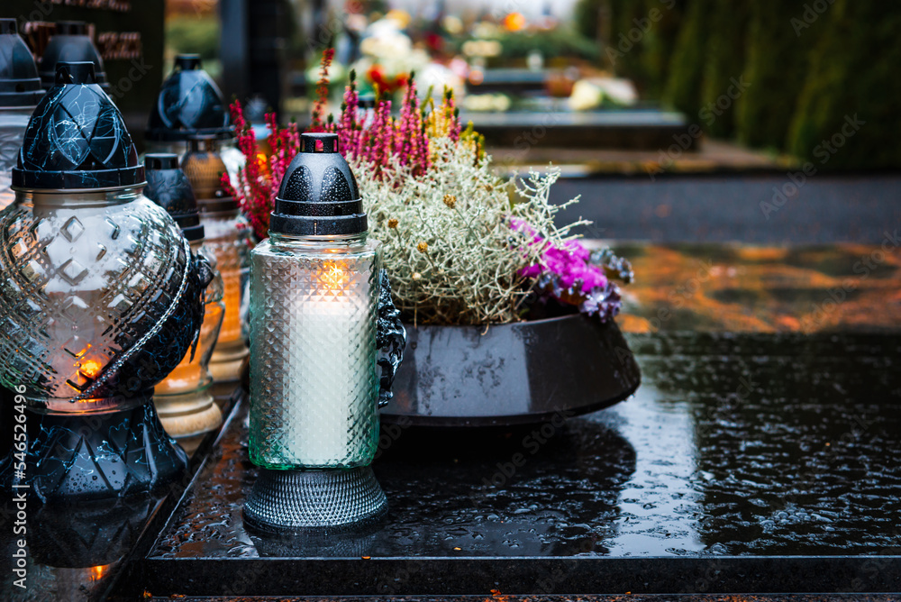 All Saints' Day and burning candles and flowers on the graves.Candles