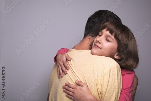 father and daughter together, dad hugging daughter close-up child's face