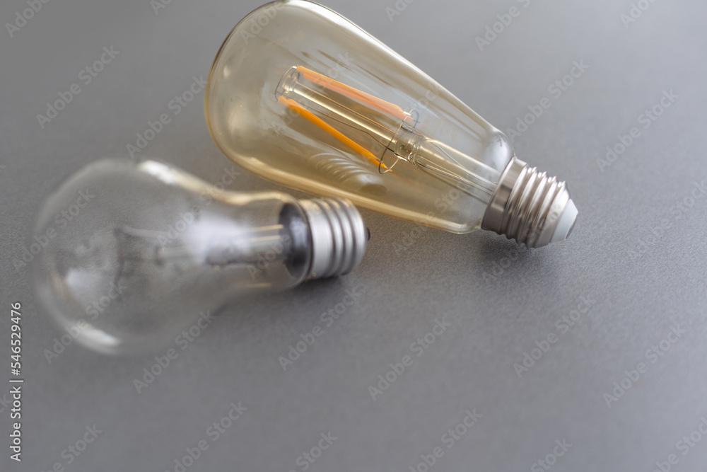 Power energy saving concept. light bulb with light on on gray background. Power energy saving concept. light bulb with light on on gray background.