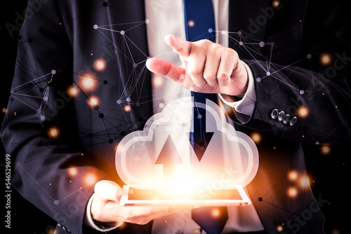 Cloud computing concept. Business man use computer tablet with cloud computing diagram show on hand.