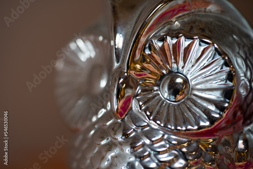 Close up of a metal sculpture of an owl