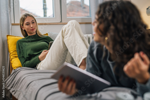 Two teenage friends having a conversation