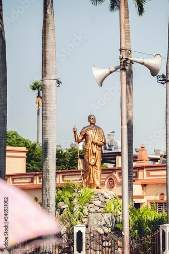 Vertical shot of the statue of Swami Vivekananda at the Hindu Dakshineswar Kali Temple, India photo