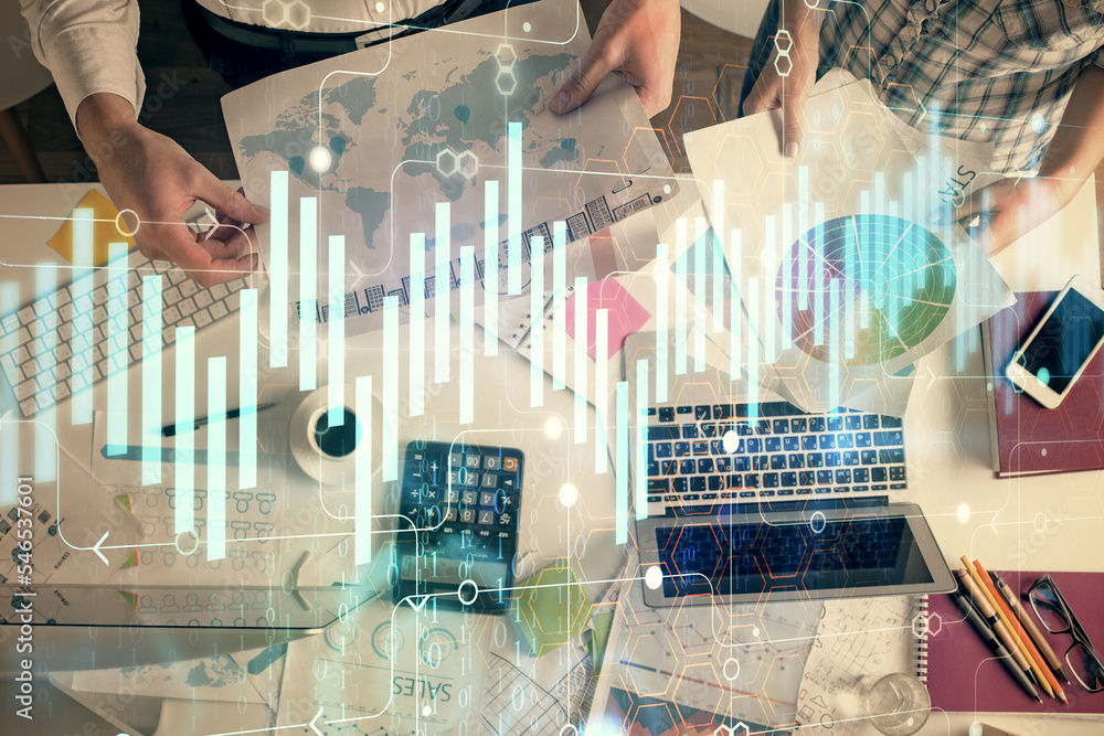 Double exposure of man and woman working together and financial chart hologram drawing. market analysis concept. Computer background. Top View. Double exposure of man and woman working together and financial chart hologram drawing. market analysis concept. Computer background. Top View.