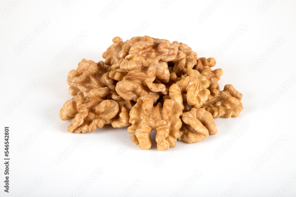 A group of peel walnuts on a white background A group of peel walnuts on a white background
