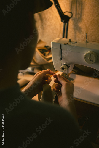 The girl sews on a sewing machine, High quality