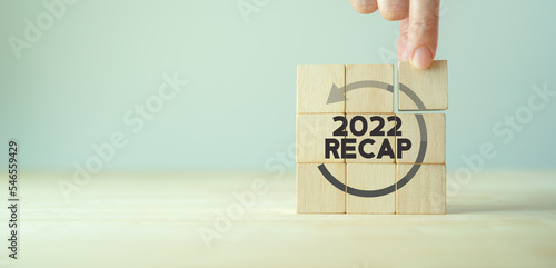 2022 Recap economy, business, financial concept. For business planning. RECAP word icon on wooden cubes on smart grey background and copy space..