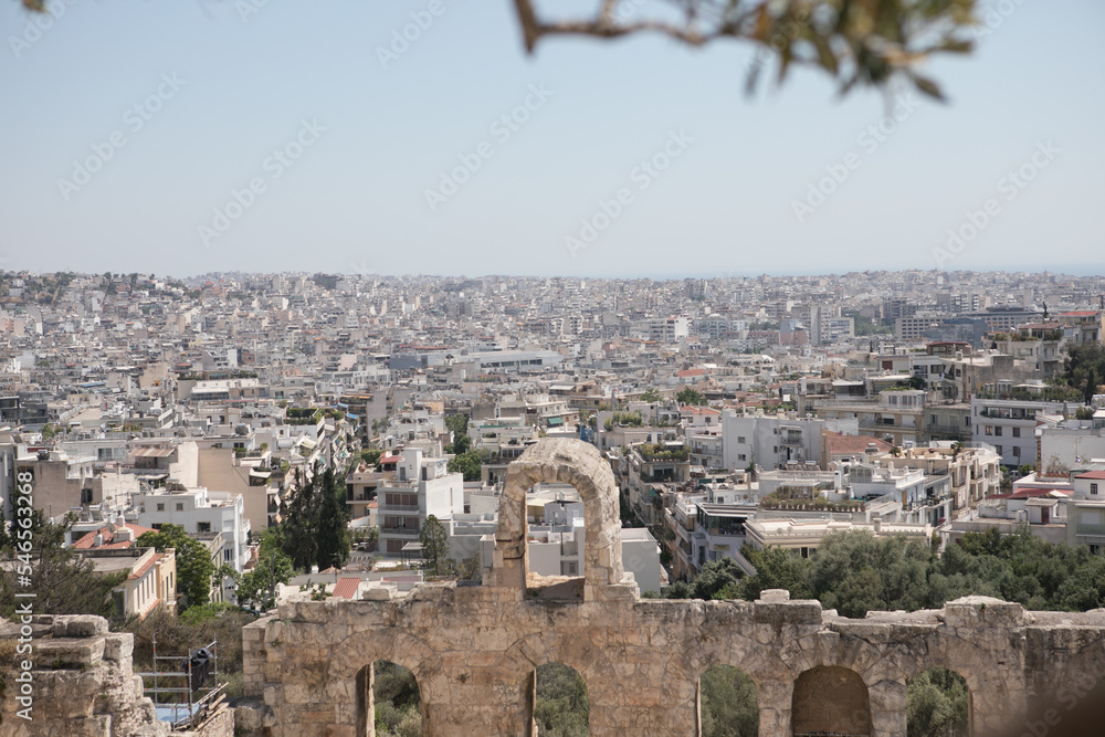 Ancient Greek ruins in Athens, Greece, Europe. Odeon of Herodes Atticus overlooking city. This stone theater is famous landmark of Athens. Old monument close-up, remains of classical Athens.