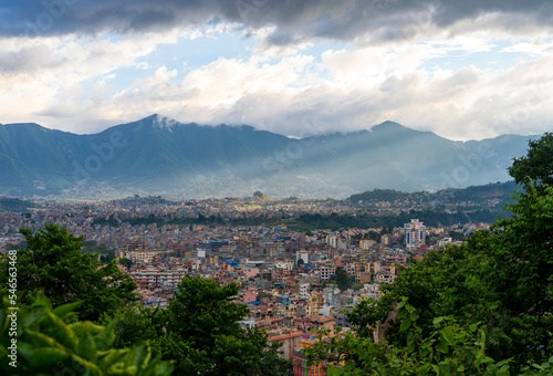 City view of Kathmandu, Nepal. Colorful buildings against the backdrop of mountains photo