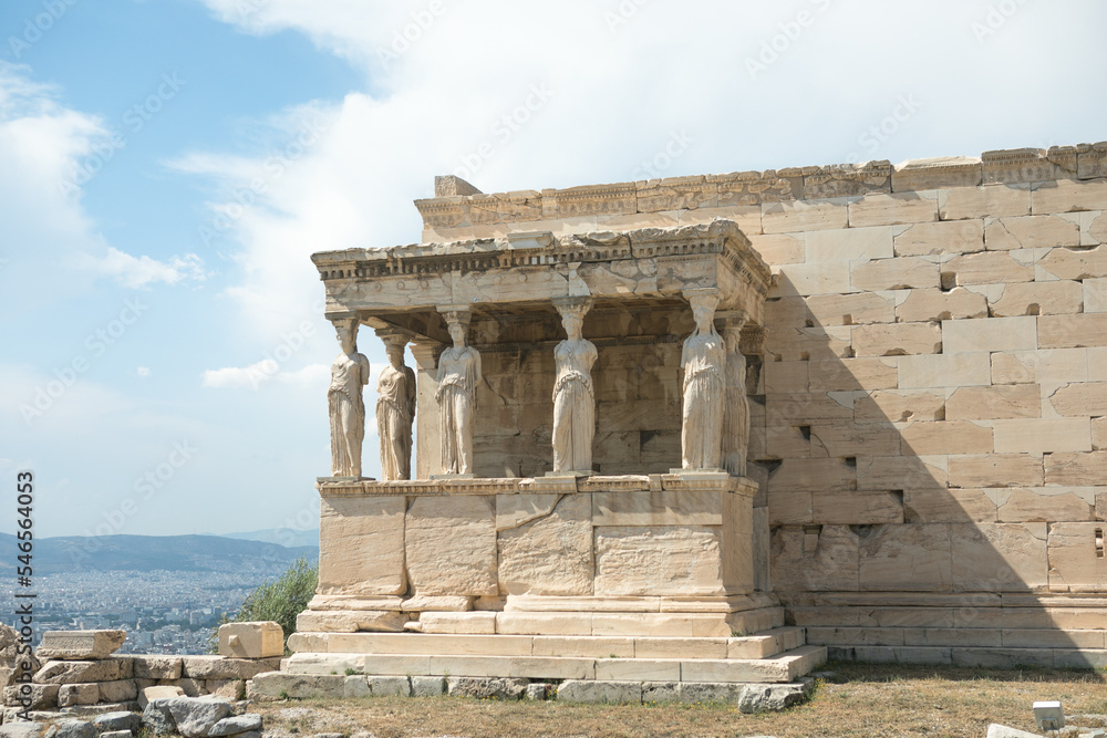Obraz premium Porch of the Caryatids at Erechtheion temple, Acropolis of Athens, Greece. The Erechtheion or Erechtheum is an ancient Greek temple of the Acropolis of Athens in Greece.