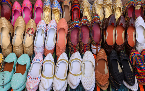 Rajasthani style handcraft foot ware in the local market at Jaipur, India.