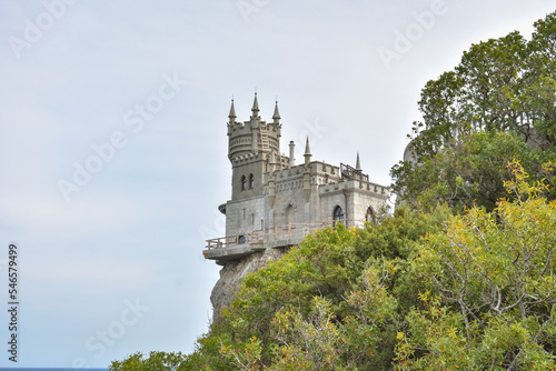 Yalta, Crimea, Russia - September 16, 2020: The decorative Neo-Gothic castle "Swallow's Nest" on the rock over the Black Sea © Олег Спиридонов