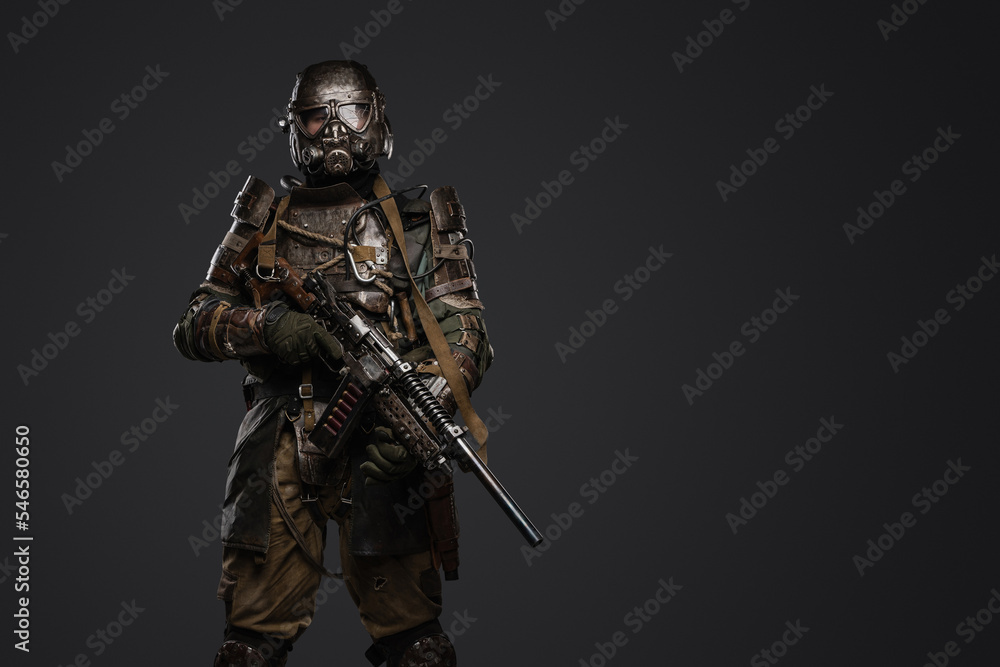 Portrait of soldier survived after atomic catastrophe with gas mask and shotgun. Portrait of soldier survived after atomic catastrophe with gas mask and shotgun.
