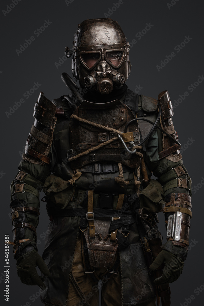 Shot of isolated on grey background soldier in setting of post apocalypse looking at camera. Shot of isolated on grey background soldier in setting of post apocalypse looking at camera.