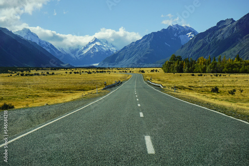 road to mount cook, new zealand with summer and autumn surround, straight way and line of street in clearly day