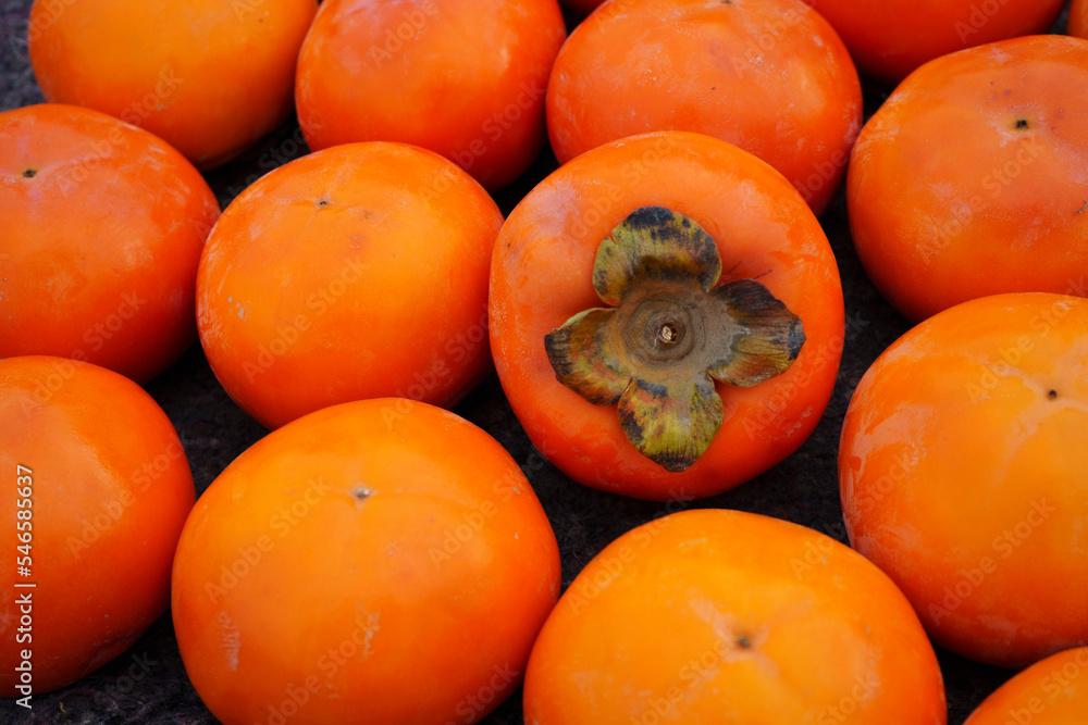 orange fresh persimmon fruit background