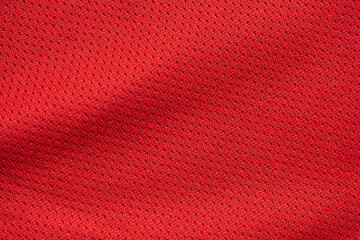 Red sports clothing fabric football jersey texture close up