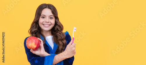 strong teeth. childrens healthy beautiful smile. cheerful teenage girl brush teeth. Banner of child girl with teeth brush, studio portrait, header with copy space.