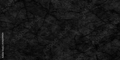 Abstract cracked stone wall texture, texture of old and grainy dark concrete wall, Panorama of Dark grey black slate grunge texture, black stone wall for cover, wallpaper and construction.